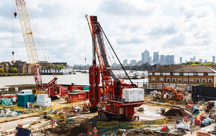 Chambers Wharf, Thames Tideway site photo with red hydrofraise rig installing diaphragm wall panels, electric hydrofraise